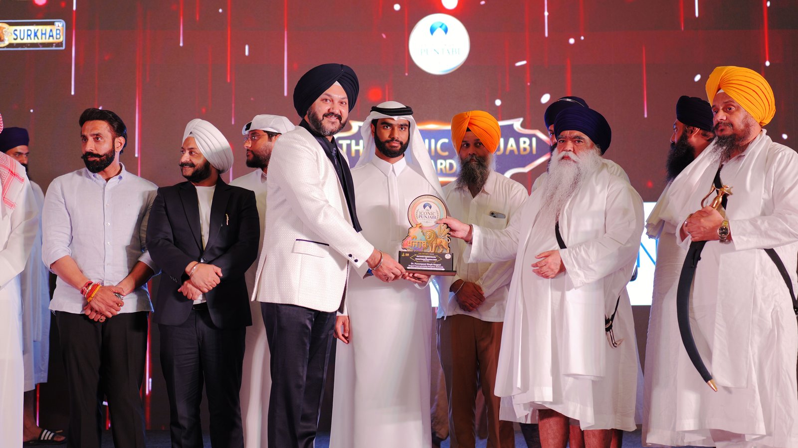 Dr. P.S. Nagpal receiving The Iconic Punjabi Awards trophy